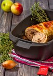 Baked duck roulade filled with meat stuffing and apples
